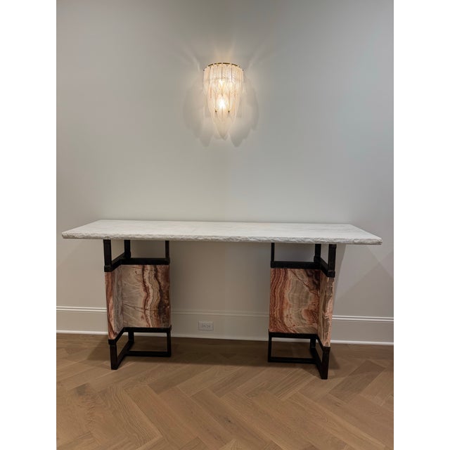 An exceptional architectural console featuring a substantial polished white marble top with a hand-chiseled natural edge,...