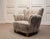 Elegant 1940s Danish lounge chair, combining generous proportions with a softly sculpted silhouette and exceptional...