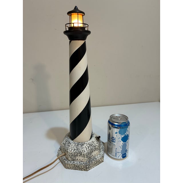 A vintage wooden Cape Hatteras Lighthouse lamp or nightlight. This great lighthouse lamp was probably locally made on the...