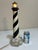 A vintage wooden Cape Hatteras Lighthouse lamp or nightlight. This great lighthouse lamp was probably locally made on the...