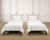 A dramatic pair of mid-century twin sized patinated iron bed frames crafted in a whimsical French Neoclassical style. The...