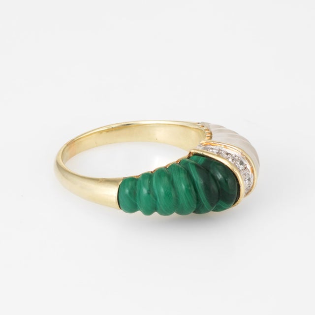Finely detailed vintage dome cocktail ring (circa 1960s), crafted in 14 karat yellow gold. Fluted malachite measures 14mm...