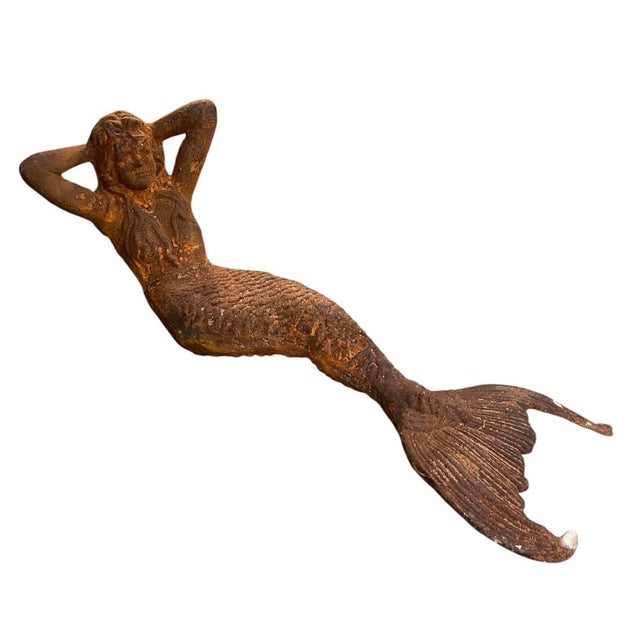 This striking, full-bodied garden sculpture depicts a reclining mermaid in a relaxed, classic pose with her arms resting...