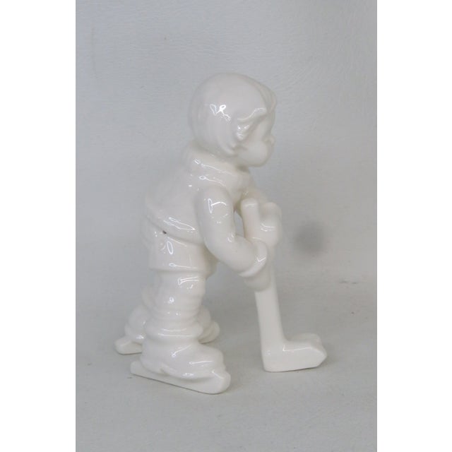 This adorable Goebel Hummel Figurine is made out of porcelain with a white glaze finish. The figurine is a very charming...