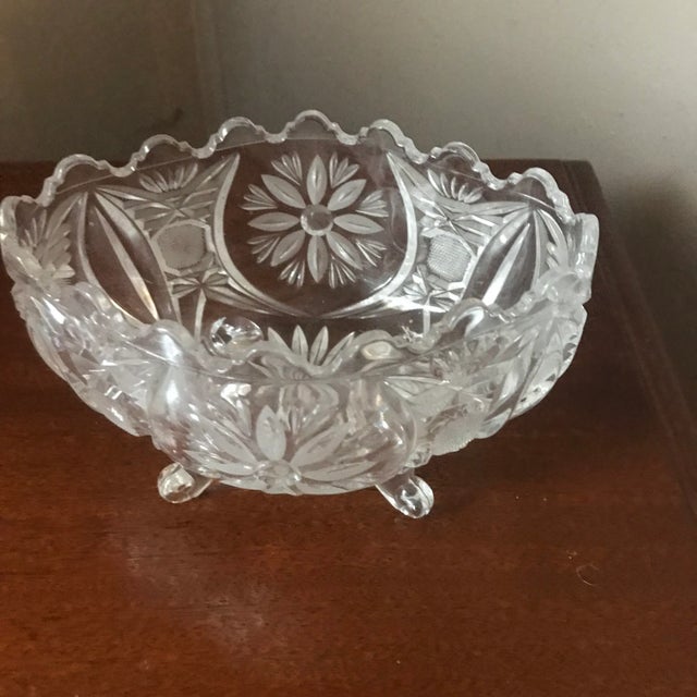 This is a beautiful and perfect footed crystal candy bowl or small serving bowl. It features cut flowers. It is in perfect...