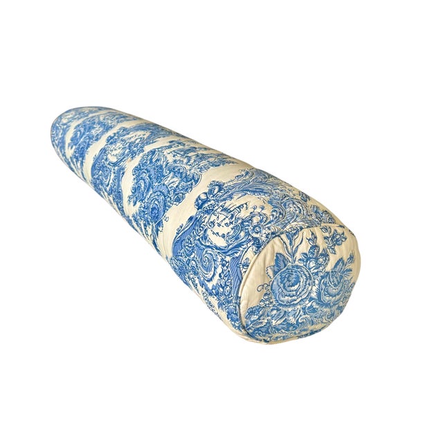 In classic blue and cream toile, these quilted bolster pillows feature 18th century scenes including a courting couple,...