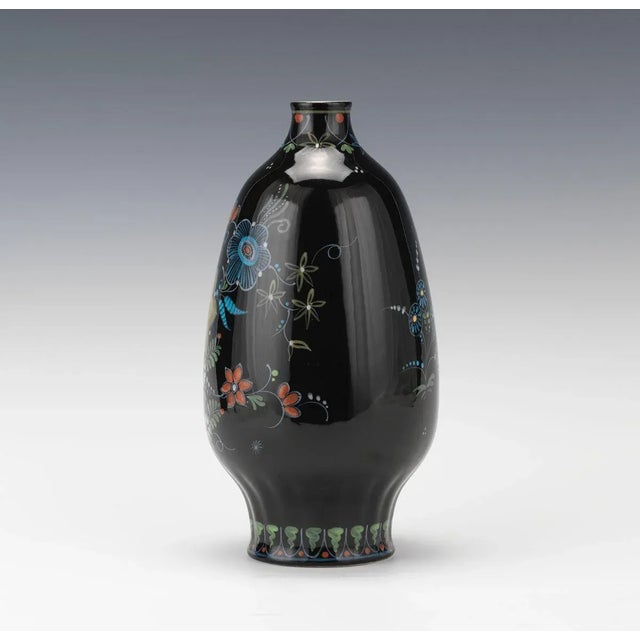 De Porceleyne Fles Delft Cabinet Vase Porcelain vase, hand painted with stylized flowers and bird, black ground color,...