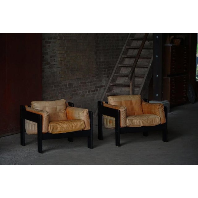 A rare pair of brutalist easy chairs designed by the danish designers rud thygesen and johnny sørensen, crafted in the...