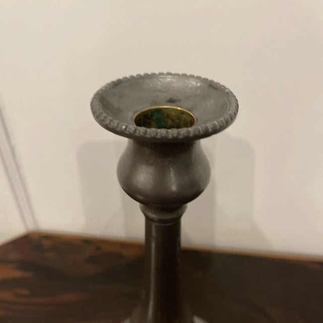 Antique mid 1800s American pewter candlestick with push-up button on bottom. Nice millgrain beaded edges.