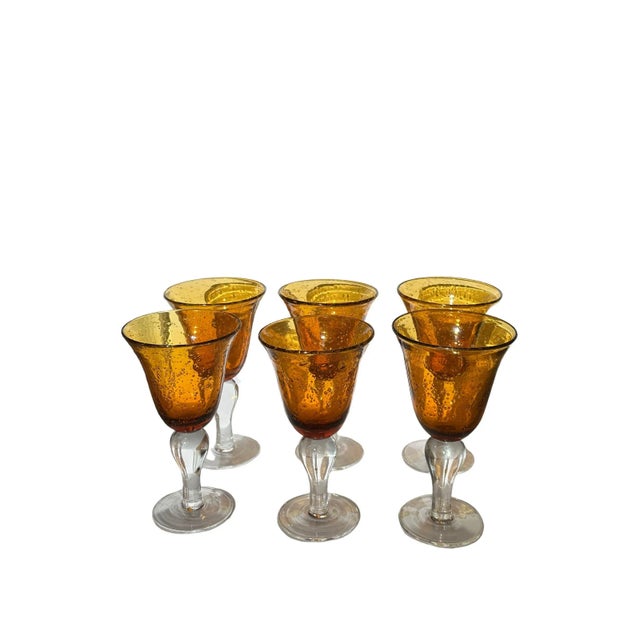 Beautiful set of blown glass goblets by Artland in the color amber. This wonderful set of 11 glasses features a bright...