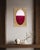 A deep, wine-dark burgundy fills the lower half of this oval, fading upward into a pale, soft blush pink, the transition...
