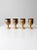 Set of four vintage studio pottery chalices showcasing the beauty of handcrafted ceramic design. Each wine glass features...
