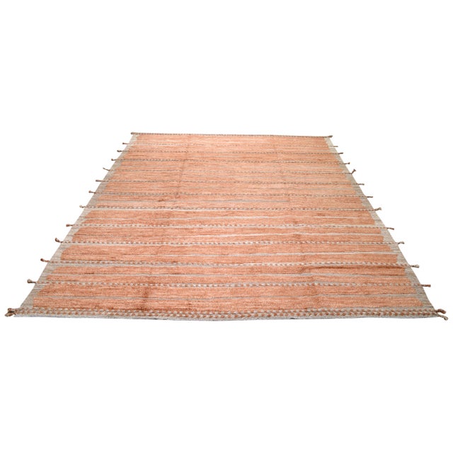 Hand-knotted with care using traditional rug-making techniques, this wool rug blends timeless craftsmanship with a modern...