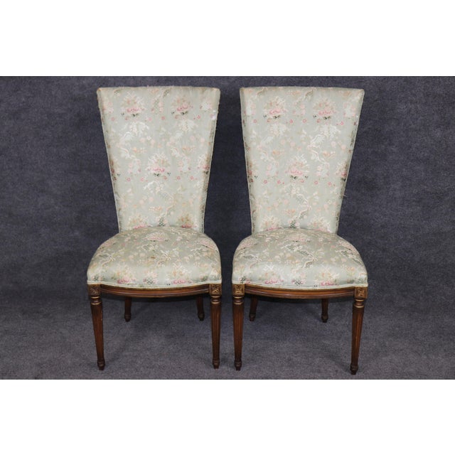 An exquisite set of eight French Louis XVI Style dining chairs, masterfully crafted to embody the timeless elegance and...