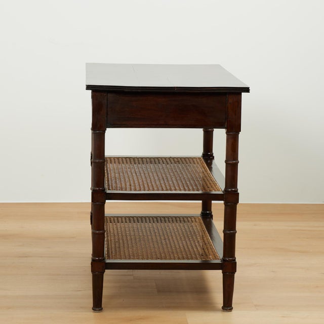 Handsome pair of 19th century British colonial stands handcrafted in rosewood with a pegged construction, having one...