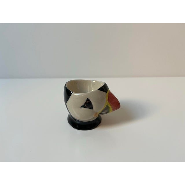 Hand-painted ceramic egg cup/trinket dish puffin figurine. Black, white, yellow and red/brown colouring. Can also be used...
