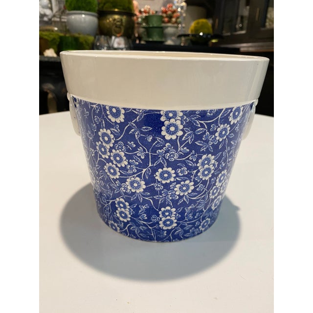 Vintage blue and white decorated with floral design English pottery planter with detail of handles on each side. No...