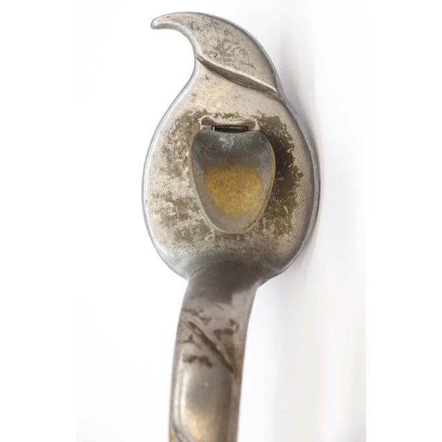 Arts & Crafts vintage nickel coated brass door pull with a thumb latch feature. This is in good condition. One available....