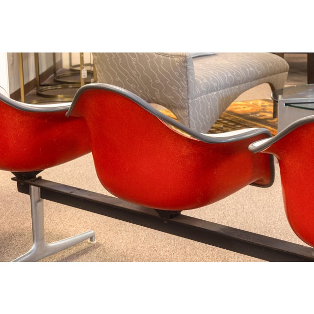 A vintage Charles & Ray Eames for Herman Miller 4 seat tandem shell chair bench. This is a very rare tandem bench from...