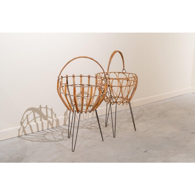 Mid-century Italian bamboo baskets from the 1950s and 60s. Both baskets feature an openwork design. One has a simpler...