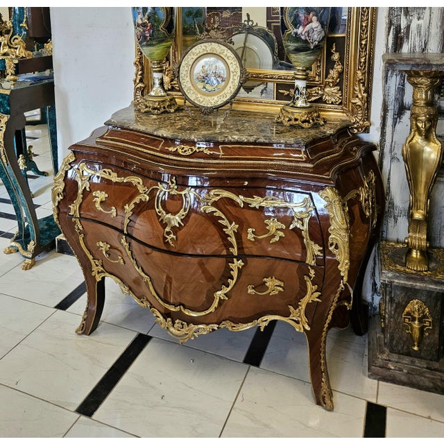 Experience the grandeur of European craftsmanship with this magnificent French Rococo-inspired dresser, masterfully...