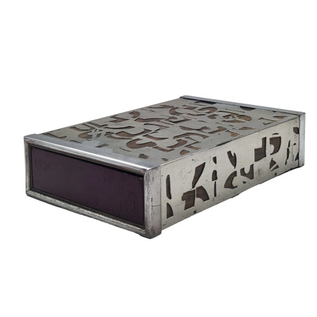 Decorative table box with an attractive perforated metal cover that reveals a warm dark wood interior.