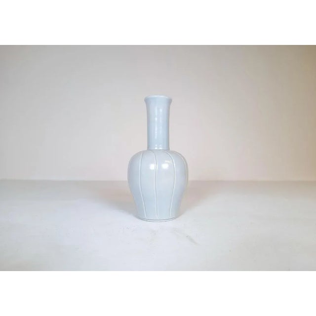 Wonderful ceramic vase manufactured in Sweden at Bo Fajans and designed by Ewald Dahlskog in 1937. The wonderful swirl...