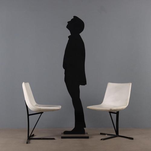 Set of 5 chairs made of enameled metal, with foam padding and faux leather upholstery. This piece is attributed to the...