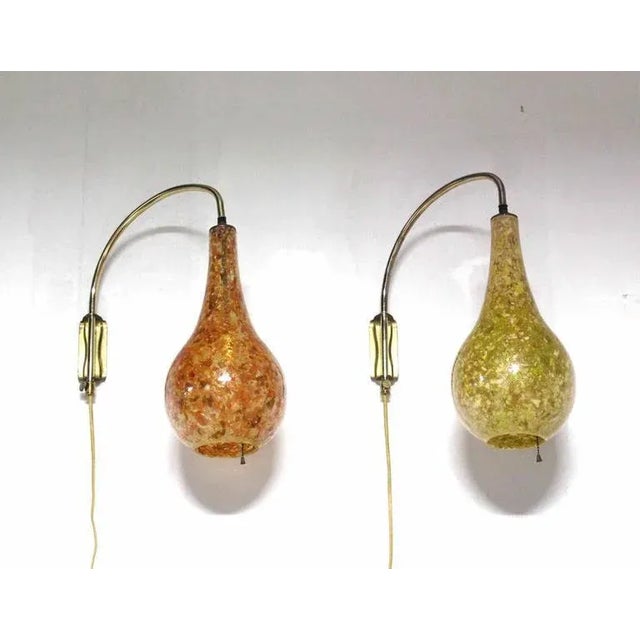 Nice pair of Mid-Century Modern light fixtures. Perfect for the hallway.