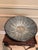 Striking oversized decorative bowl crafted from black-finished wood and inlaid with natural mother of pearl in a dramatic...
