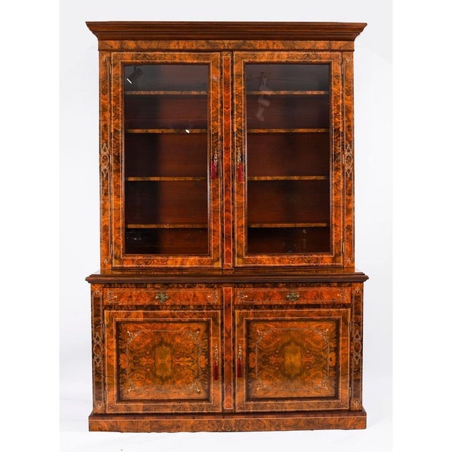 This is a beautiful antique Victorian burr walnut and marquetry inlaid bookcase or display cabinet, Circa 1880 in date....