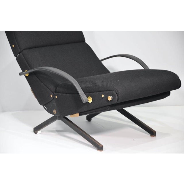 P40 armchair by Osvaldo Borsani for Tecno. Adjustable backrest, armrests, and seat; extendable footrest. Leather...