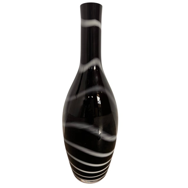 7” Diam x 16”H This hand-blown ribbon vase is a striking example of Polish art glass from the historic Krosno region, most...