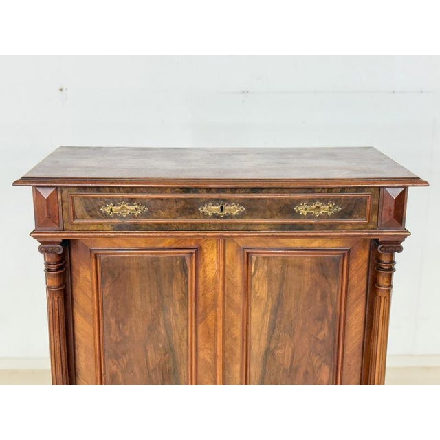 For sale is this impressive Gründerzeit-era vertiko, captivating with its classic design and particularly deep, expressive...
