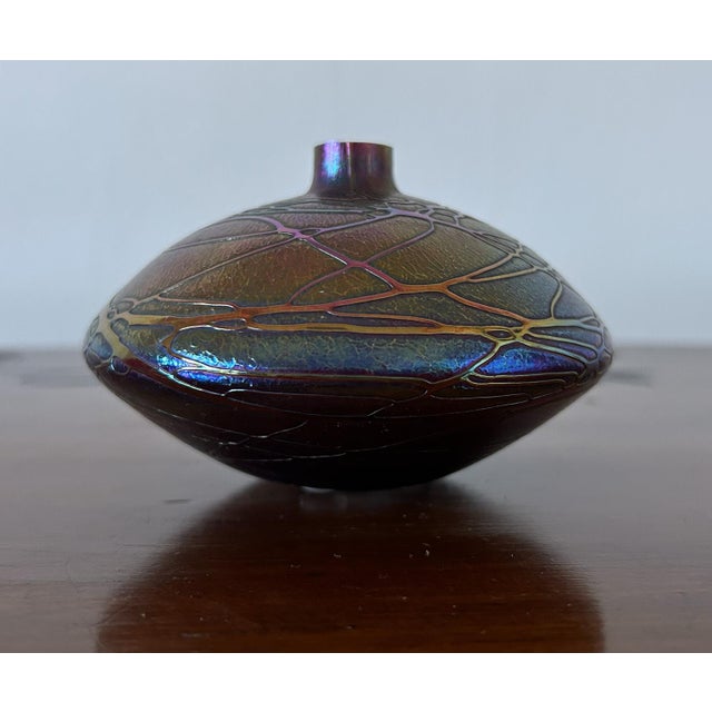 Johann Loetz (Attributed to) Glass spinning top vase with an iridescent polychrome surface and a spiderweb decoration (a...