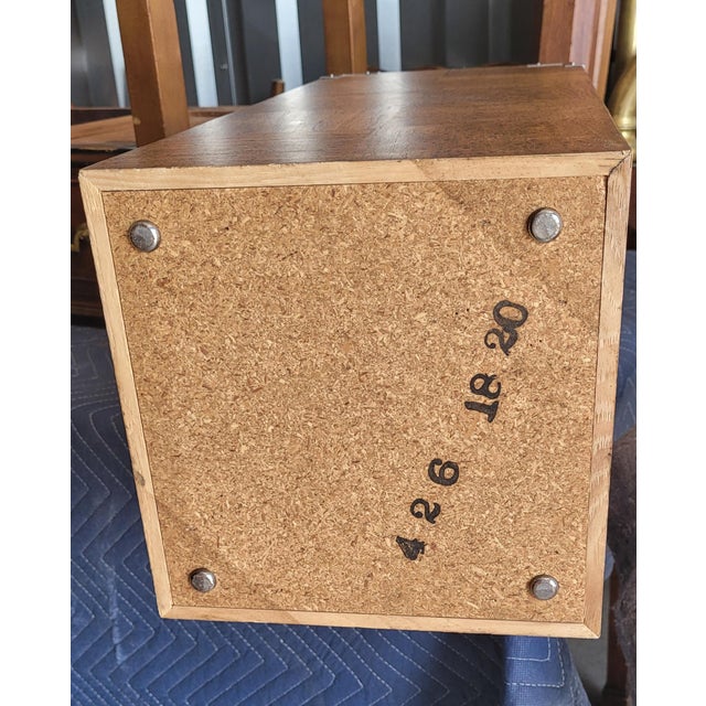 Vintage pedestals in the manner of Milo Bauman. Features a burlwood pattern body, black smoke glass tops and silvered...