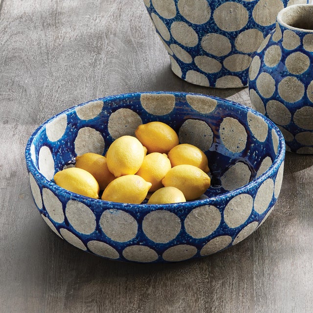 In a nod to midcentury pottery, this fun, fashion statement makes a memorable centerpiece. Fill with mood moss or...