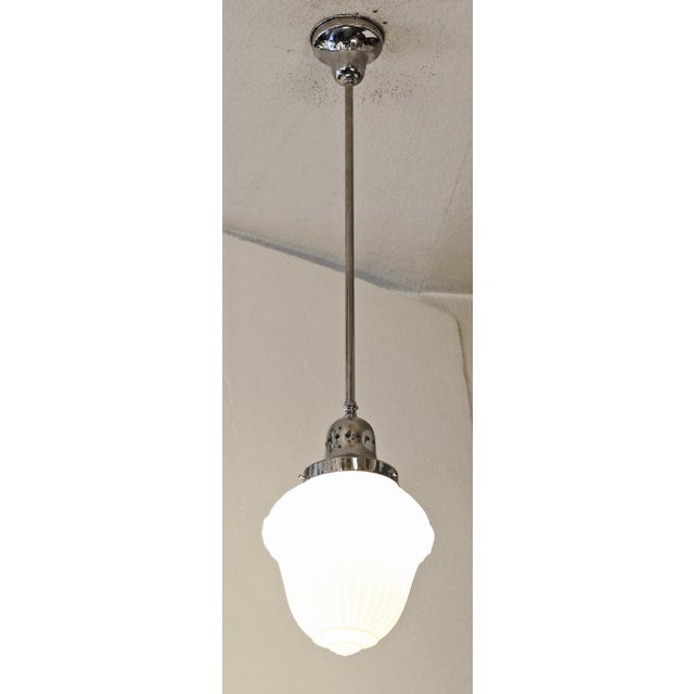 Art Deco Lamp Art Deco pendant lamp, circa 1925. Nickel-plated brass ceiling rose, brass tube and body. White cased glass...