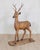 A striking Italian 20th century life-size deer sculpture, expertly hand-carved in solid walnut with a wonderfully...