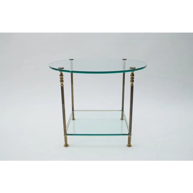 Italian Round Glass and Brass Coffee Table, 1970s, in Very Good conditions. Designed 1970 to 1979