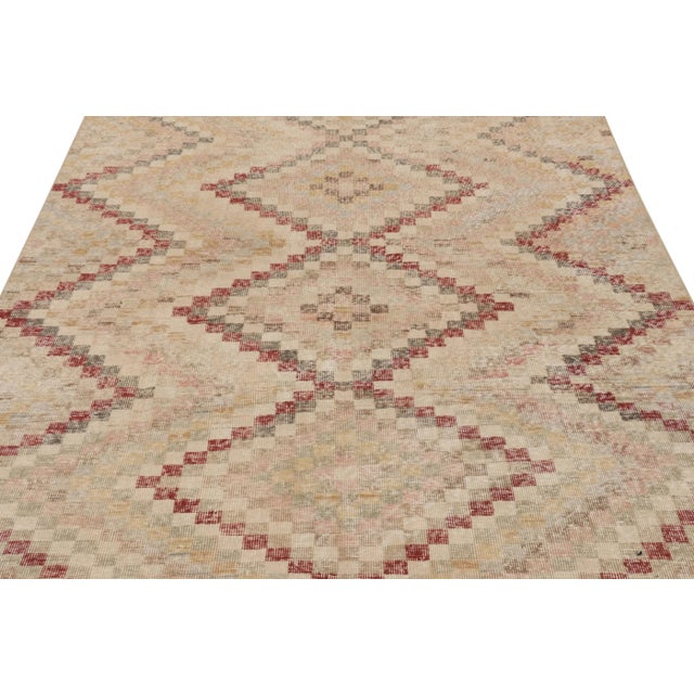 This vintage rug is a 6x9 Turkish distressed piece, made with hand-knotted wool circa mid-20th century. It is an exciting...