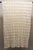A beautifully handcrafted vintage crochet tablecloth featuring an intricate swirling floral motif. Its delicate openwork...