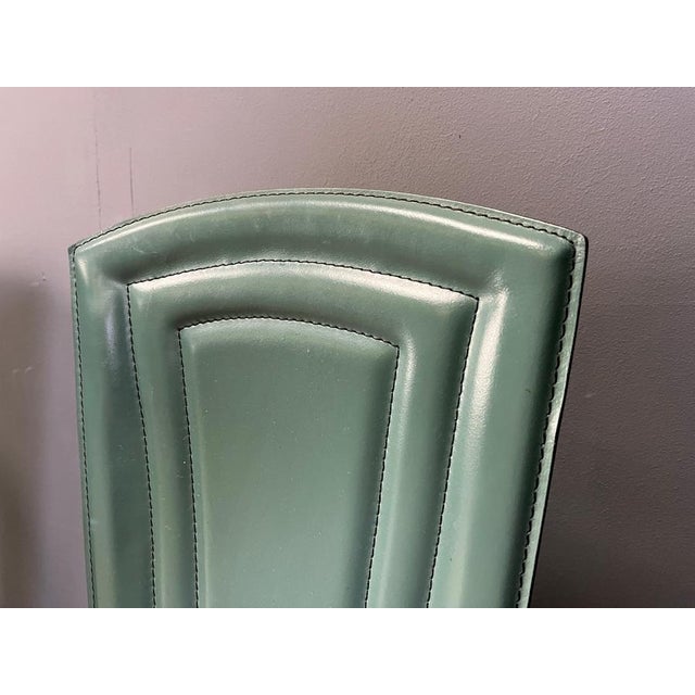 Set of 4 italian dining chairs with green reeded leather upholstery. Beautiful design 1980s - Italy Very good condition...