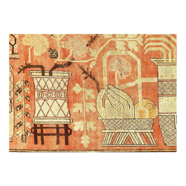 Originating from East Turkestan between 1920-1940, this antique transitional Khotan rug has a medallion-style field design...