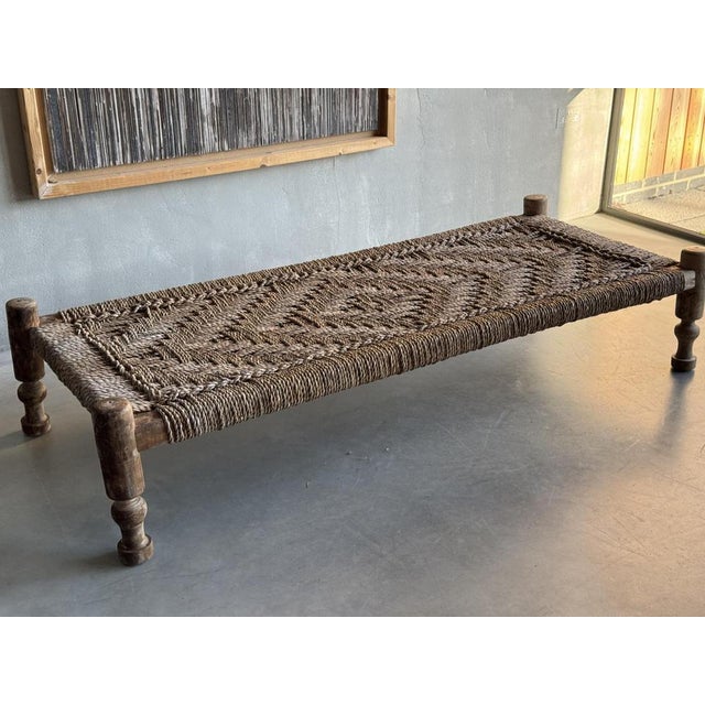 A Rope Work Coffee Table / Day bed with lovely dry faded patina on turned legs. The stiffly roped and patterned surface...