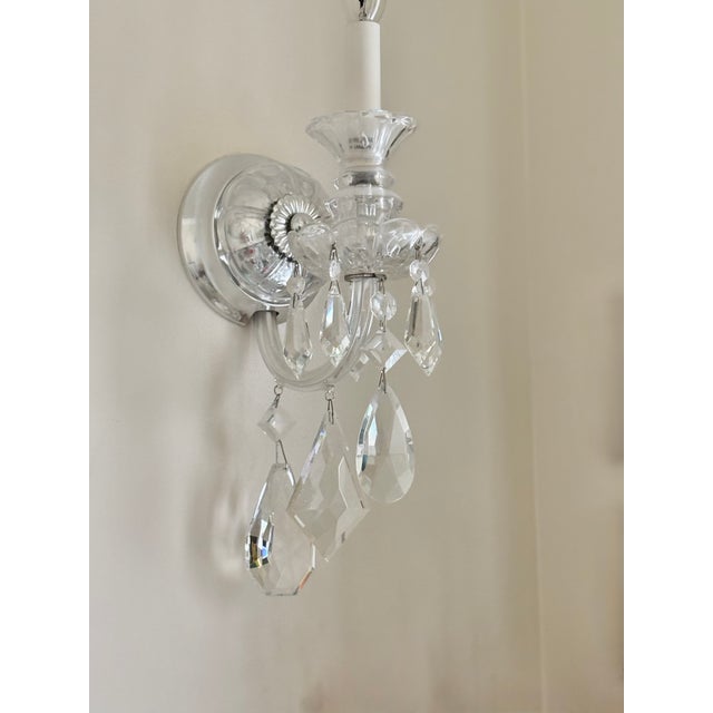 Shimmering and glimmering these crystal sconce chandeliers are the perfect addition to any room where elegance and sparkle...