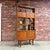 Vintage mid-century modern teak and Afromosia room divider bookcase in the manner of OFM Belgium, c.1960s-70s. This...
