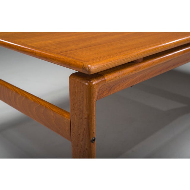 Elegant Danish mid-century coffee table by Komfort, dating from the 1960s. Crafted in teak, the table features clean...