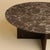 Emperador Dark marble over a base of solid oak gives the Hirado its balance. It is a low table for the space in front of a...