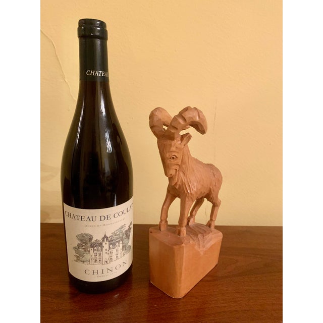 Available is an antique early / mid-20th century wooden carved sculpture of a Spanish Ibex (also known as the Portugese...